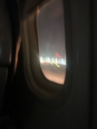 a view from the window of an airplane at night